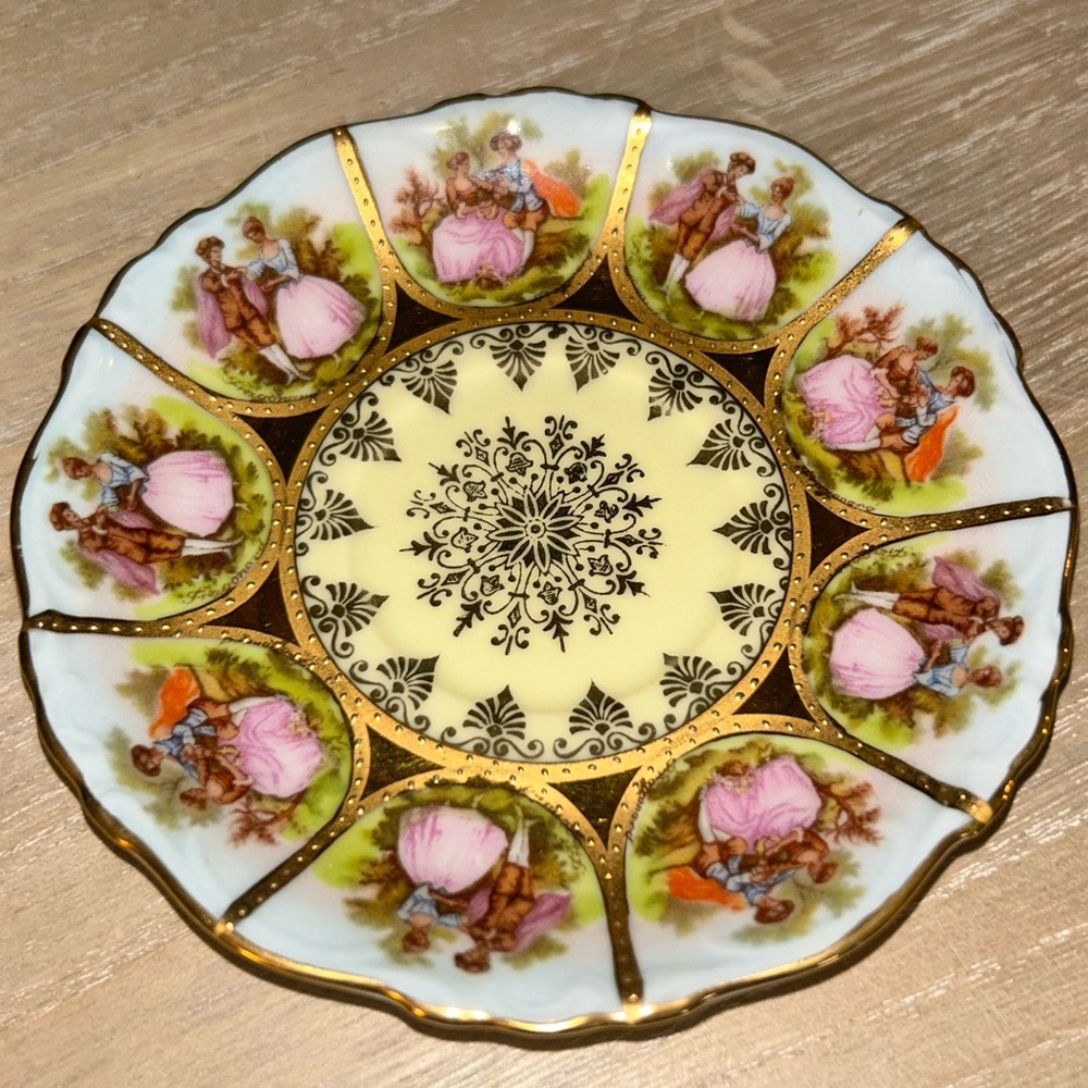 This exquisite 4.5” saucer from NC features a beautiful hand-painted design.